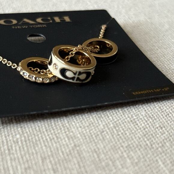 Coach Multi-Ring Pendant Necklace Gold Cream Black Enamel Crystal NWT 16”+2” - Picture 3 of 10
